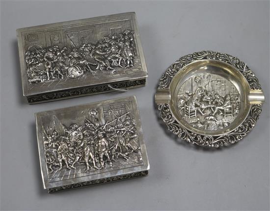 Two Dutch silver cedar-lined cigarette boxes and a circular silver ashtray,